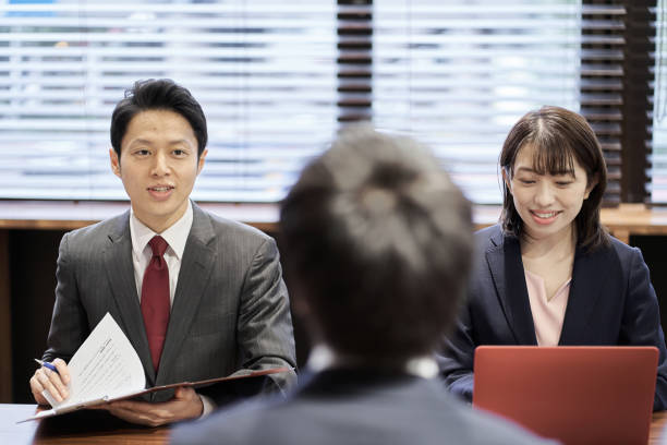 istock Asian managerial business person interviewing 1352642980