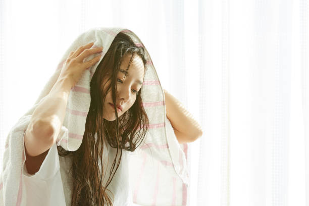Portrait of a young Asian woman after taking a bath morning wet hair stock pictures, royalty-free photos & images
