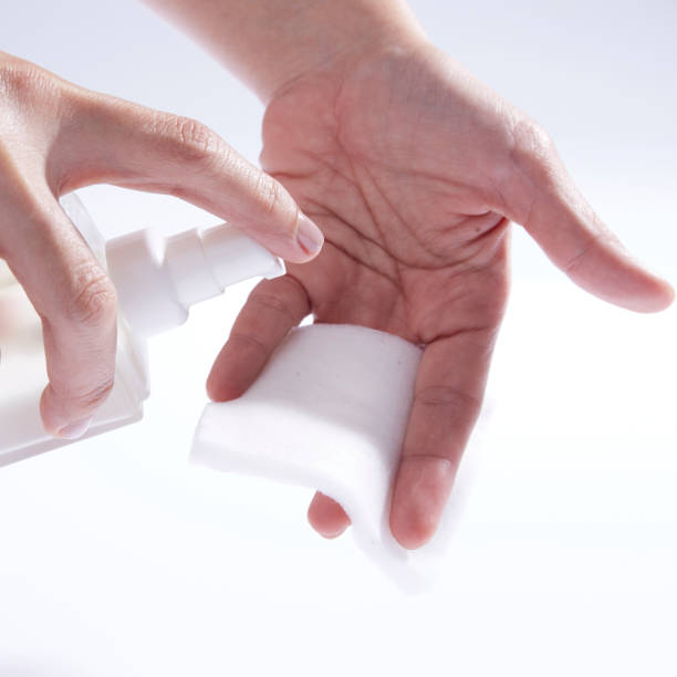 istock Female hands pressing on cosmetic essential oil bottle 1352646542