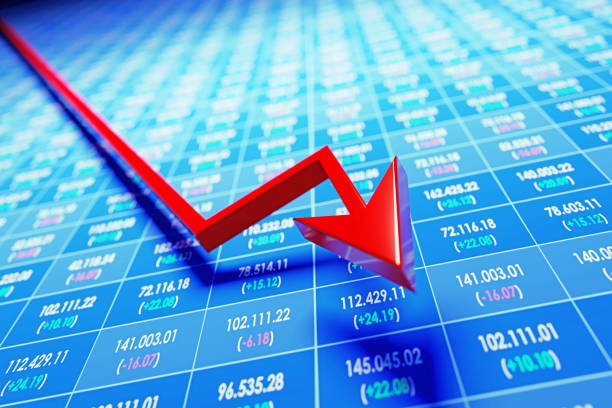 istock Red Arrow Moving Down Over Stock Market Data On Trading Board 1352651735