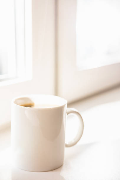 istock cup of coffee on the window sill 1352651885