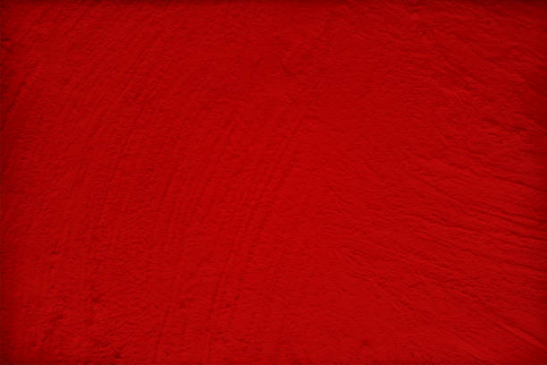 istock Blank empty dark red or maroon coloured scratched grunge textured vector Christmas wrinkled crinkled horizontal backgrounds like a plastered wall 1352652216
