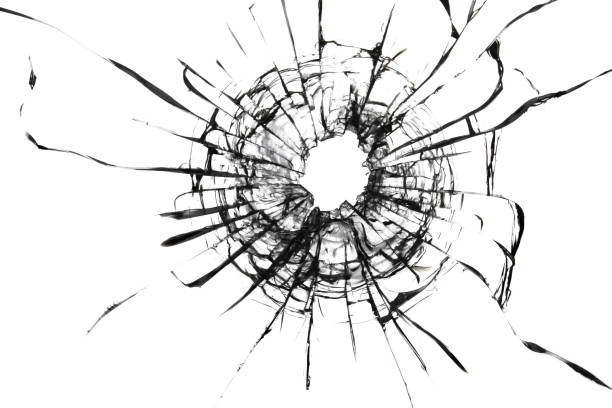 istock Shot hole, texture of cracks on the glass. Broken windshield. Damaged car window. 1352653985