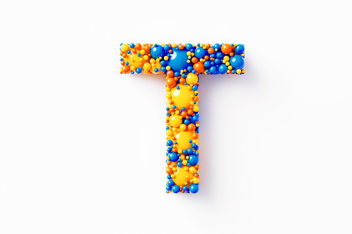Colorful capital letter T made of many spheres sitting on white background. Horizontal composition with clipping path and copy space. Directly above.