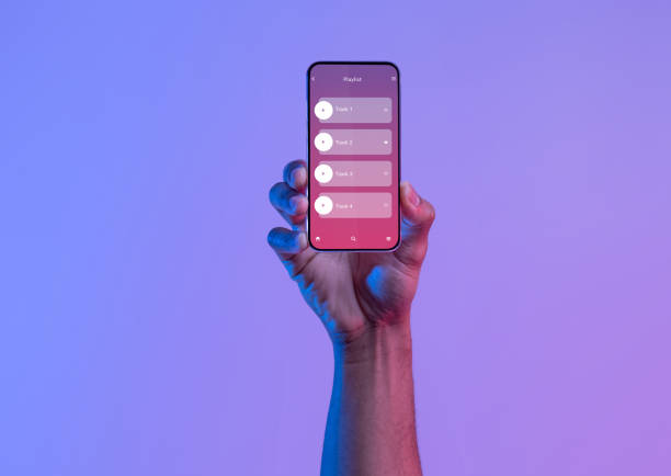 Black Male Hand Holding Smartphone With Opened Audio Player Interface