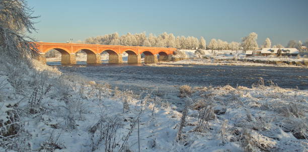 istock Long brick bridge over Venta river in winter day, Kuldiga, Latvia 1352656981