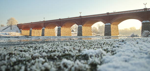 istock Long brick bridge over Venta river in winter day, Kuldiga, Latvia 1352657570