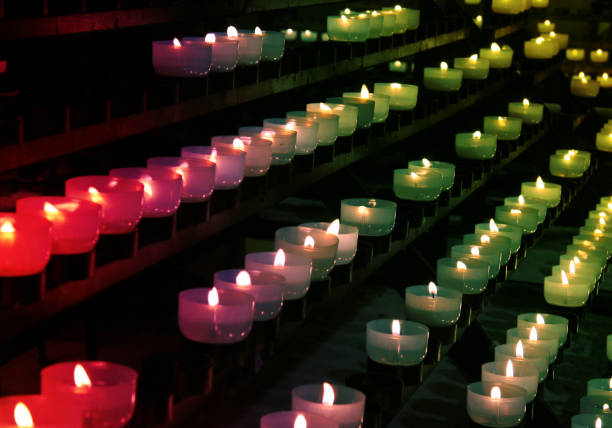 istock Burning candles in catholic church 1352659273