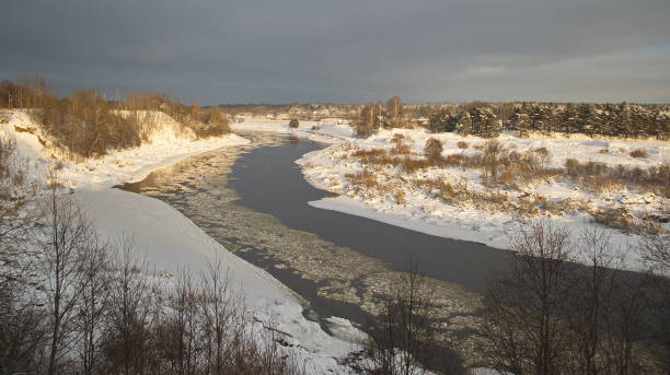 istock Beautiful river Venta bend on a sunny winter day. Kuldiga, Latvia 1352659647