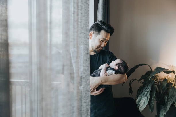 istock Father spending time with newborn baby 1352660685