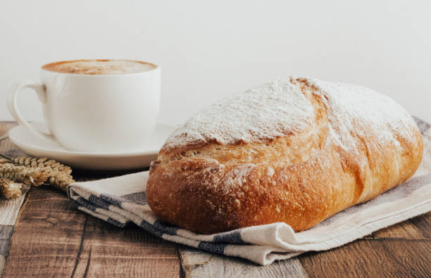 istock fresh bread on wooden background 1352663223