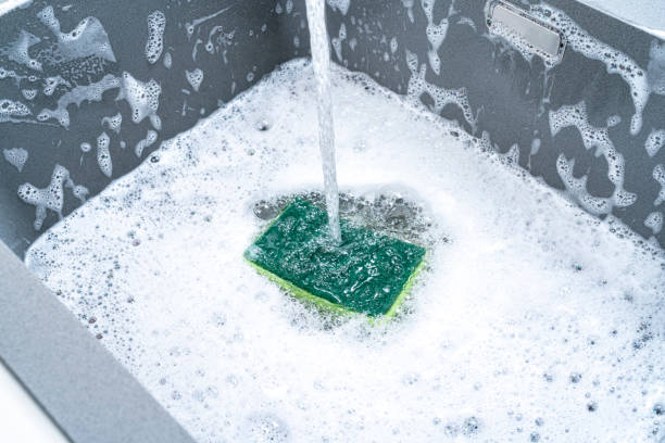 istock Cleaning sponge with soap sun in a sink 1352663647