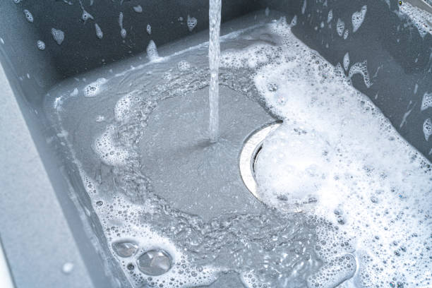 istock Running water and soap sun in a kitchen sink 1352663652