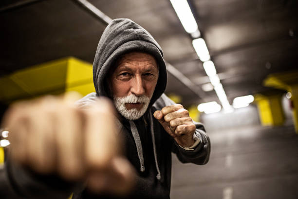 Senior male fighter boxing