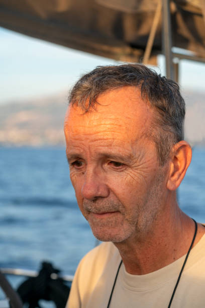 istock Portrait of a man on a sailboat while sailing 1352665347