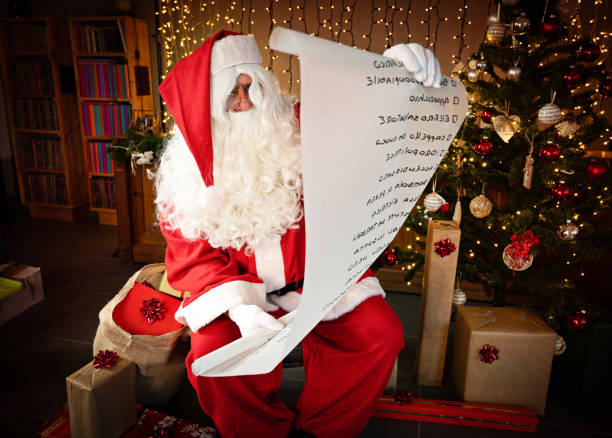 istock Santa Claus and Wish list 1352666664