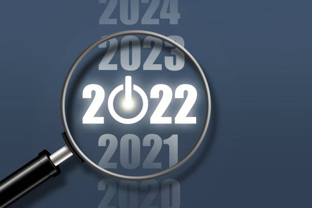 istock 2020, 2021, 2022, 2023, 2024 neon glowing numbers on dark green background. Magnifying glass. Power button.3D illustration. New year banner. Concept for the start of the new 2022. Copy space. 1352668101