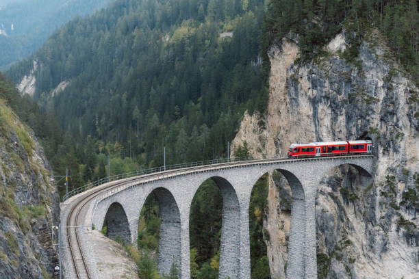 istock red train passing Landwasserviadukt in Switzerland 1352669249