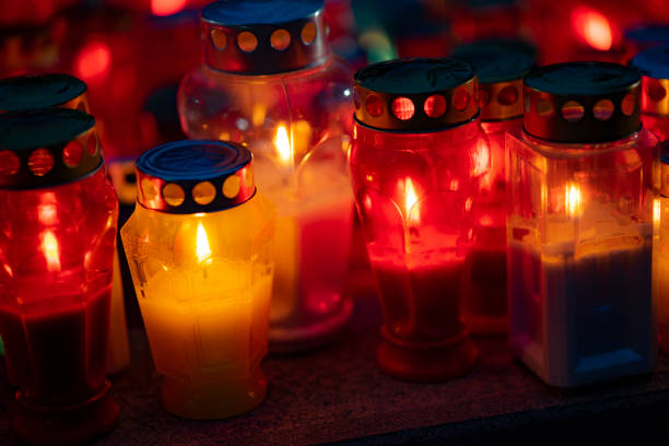 istock lighted candles in the cemetery 1352671808