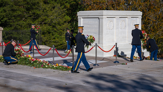 Arlington Cemetery for Veteran's Day Ceremonies of 100 Anniversary of the Tomb of Unknown Soldier.  Public laying flowers at Tomb of Unknown for a special 100 Anniversary of the Tomb celebration