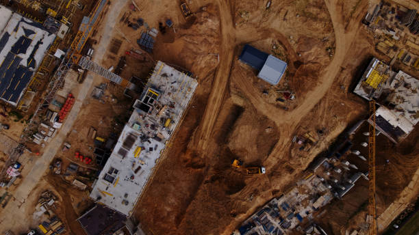 istock Construction site for a new city block. Construction work is underway. Aerial photography. 1352675108