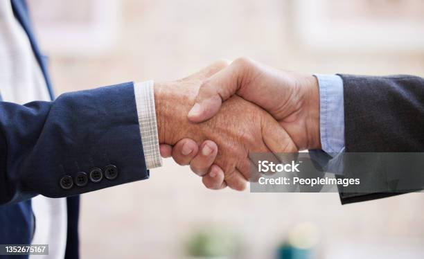 Shot Of Two Unrecognizable Businesspeople Shaking Hands Stock Photo - Download Image Now
