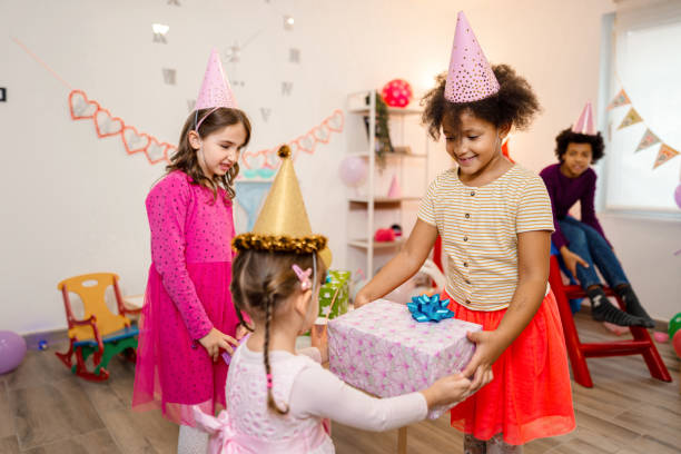 istock Little girl receiving presents 1352677892