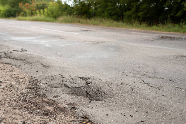 istock Uneven road surface in the countryside 1352678544