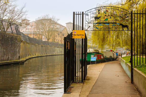 Entrance to the Regent's Canal walk. London, United Kingdom; March 16th 2011: Entrance to the Regent's Canal walk. small houseboats stock pictures, royalty-free photos & images
