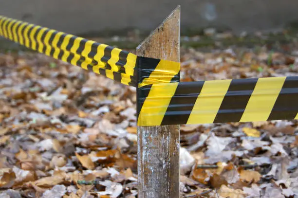 Tape restrictive fence. yellow-black color.