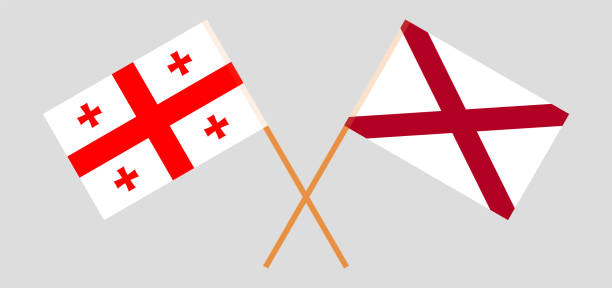 Crossed flags of Georgia and The State of Alabama. Official colors. Correct proportion Crossed flags of Georgia and The State of Alabama. Official colors. Correct proportion. Vector illustration alabama football stock illustrations