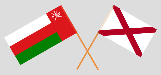 Crossed flags of Oman and The State of Alabama. Official colors. Correct proportion Crossed flags of Oman and The State of Alabama. Official colors. Correct proportion. Vector illustration alabama football stock illustrations