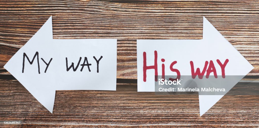 God Jesus Christ way of life. The path to eternal life. Follow God. God Jesus Christ way of life. Choose the path to eternal life. Follow God. The biblical concept of godly wisdom, guidance, leading, and Christian growth. Handwritten words on paper arrows. A closeup. Jesus Christ Stock Photo