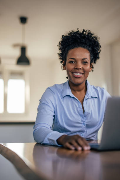 istock Postive african-american businesswoman, preparing for work 1352685427