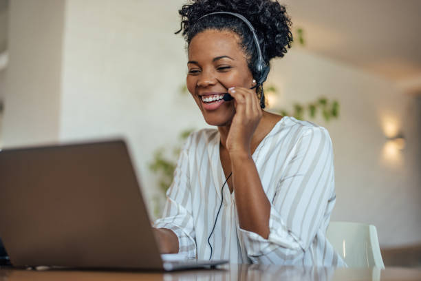 Lovely african-american woman, working as a sales person stock photo