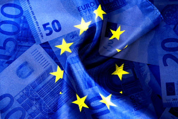 Flag of the European Union and Euro Money stock photo