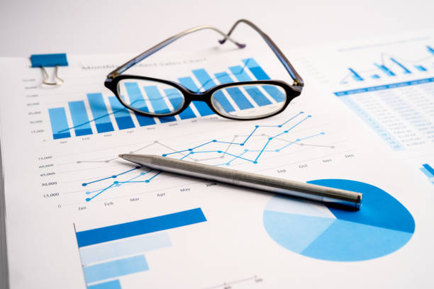 istock Graph with pen and glass. Finance development, Banking Account, Statistics Investment Analytic research data economy, trading, Mobile office reporting Business company meeting concept. 1352685823
