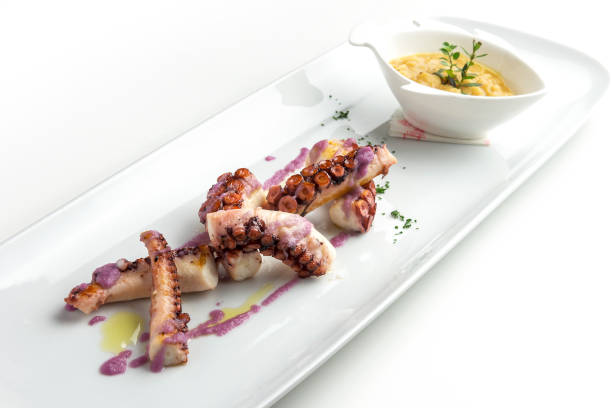 istock Fish dish, Peas with octopus with caramelized red onions 1352685824