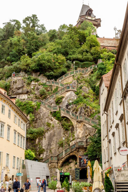 schlossbergplatz and stairway to the clock tower - graz austria clock tower styria imagens e fotografias de stock