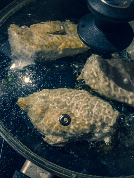 istock Chicken breast fillets on frying in a pan. 1352686717