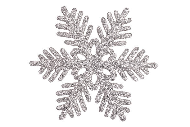 Decorative ornate gold-colored snowflake on white background
