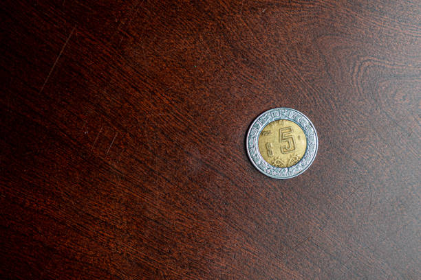 istock Copy Space Shot Directly Above a Mexican 5-Peso Coin From 2002 1352688683
