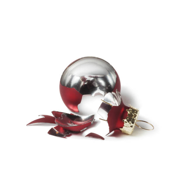 istock Broken red christmas ball isolated on white background. 1352690017