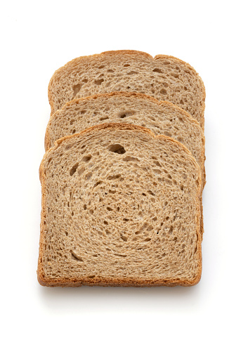 Three slices of spelled bread on white background