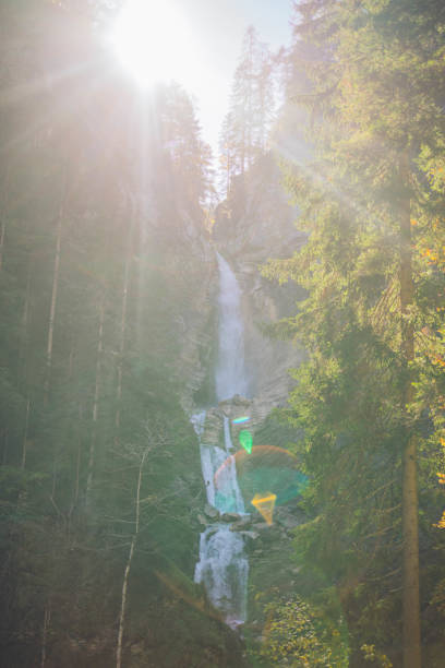Sunlight shines down, into the canyon