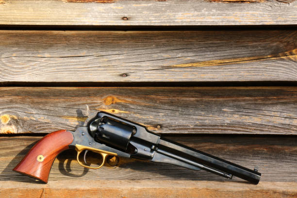 istock Black powder revolver on an old board. 1352694066