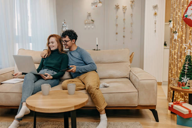 istock Young couple working during Christmass 1352695463