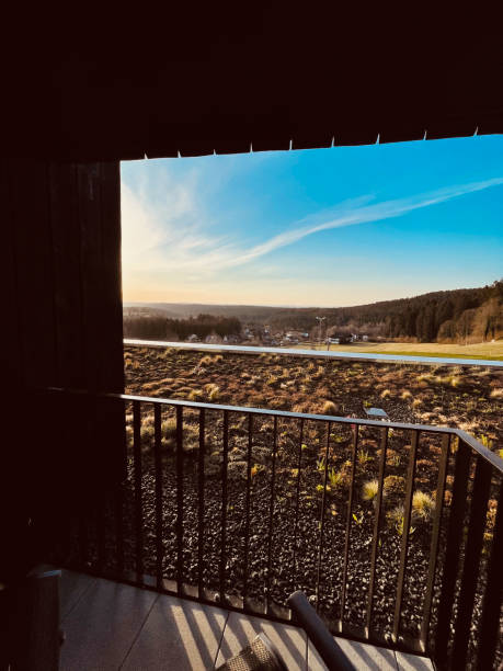 istock View over landscape and hills from  balcony at sunrise 1352697309