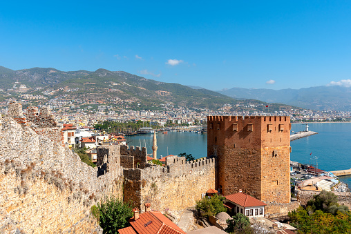View of the resort town of Alanya, the Red Tower (Kyzyl Kule) on the shores of the Mediterranean Sea.