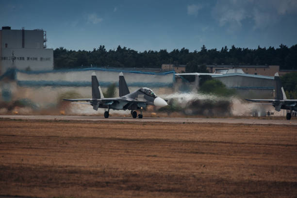 istock Modern military jet fighter at the runway ready to take off 1352700156